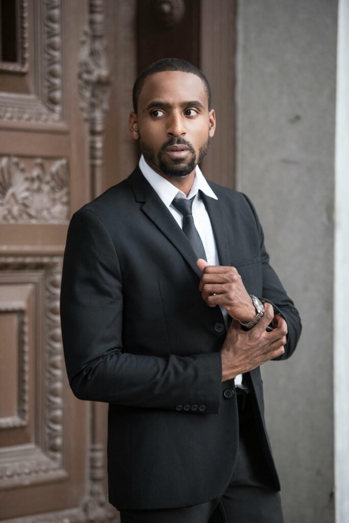 Men’s Suit Alterations – Eva’s Alterations Jacksonville Man in tailored black suit – formalwear alterations by Eva’s Alterations Jacksonville